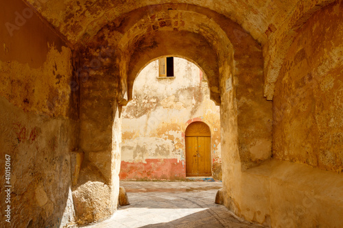 Fototapeta Naklejka Na Ścianę i Meble -  Narrow street in the historic center of Ugento, Salento, Apulia, Italy - Europe