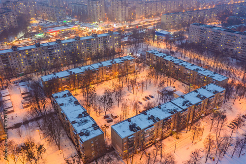 Winter evening aerial view to residential area Saltivka in Kharkiv, Ukraine. Saltivske Highway and microdistricts photo