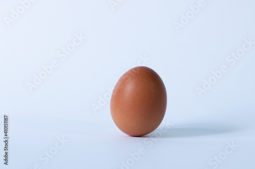 red egg on a white background. creative idea. equilibrium and balance concept.