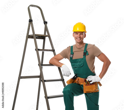 Professional constructor near ladder on white background