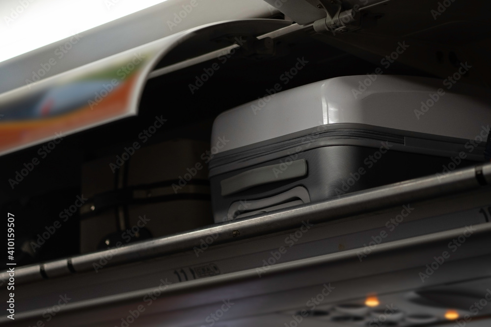 Fototapeta premium Overhead compartment for put luggage on airplane..