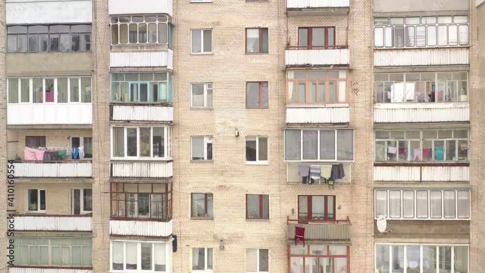Facade of the panel building. Typical houses in the post-Soviet countries Facade of the panel building. Typical houses in the post-Soviet countries