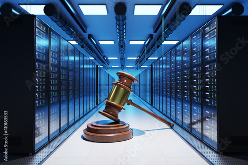 giant judge gavel in large modern data center with multiple rows of network internet server racks, internet law and order conceptual; 3D Illustration photo