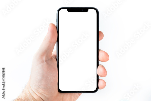 The hand is holding the white screen, the mobile phone is isolated on a white background with the clipping path.