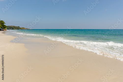 Beach and waves tropical sea with blue sky on sunny day background. copy space