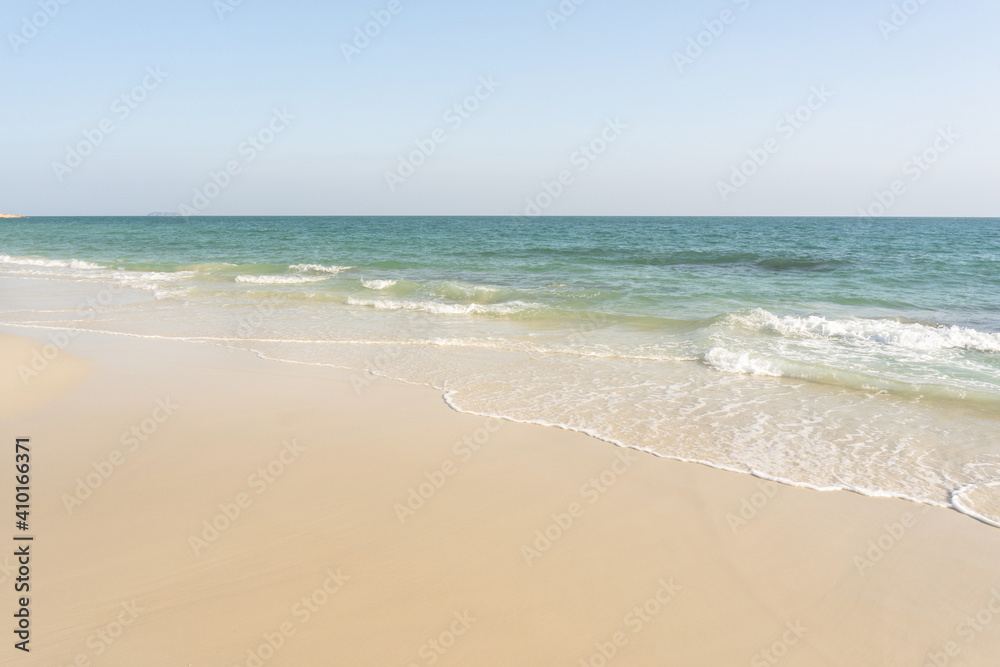 Beach and waves tropical sea with blue sky on sunny day background. copy space