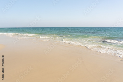 Beach and waves tropical sea with blue sky on sunny day background. copy space