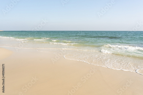 Beach and waves tropical sea with blue sky on sunny day background. copy space