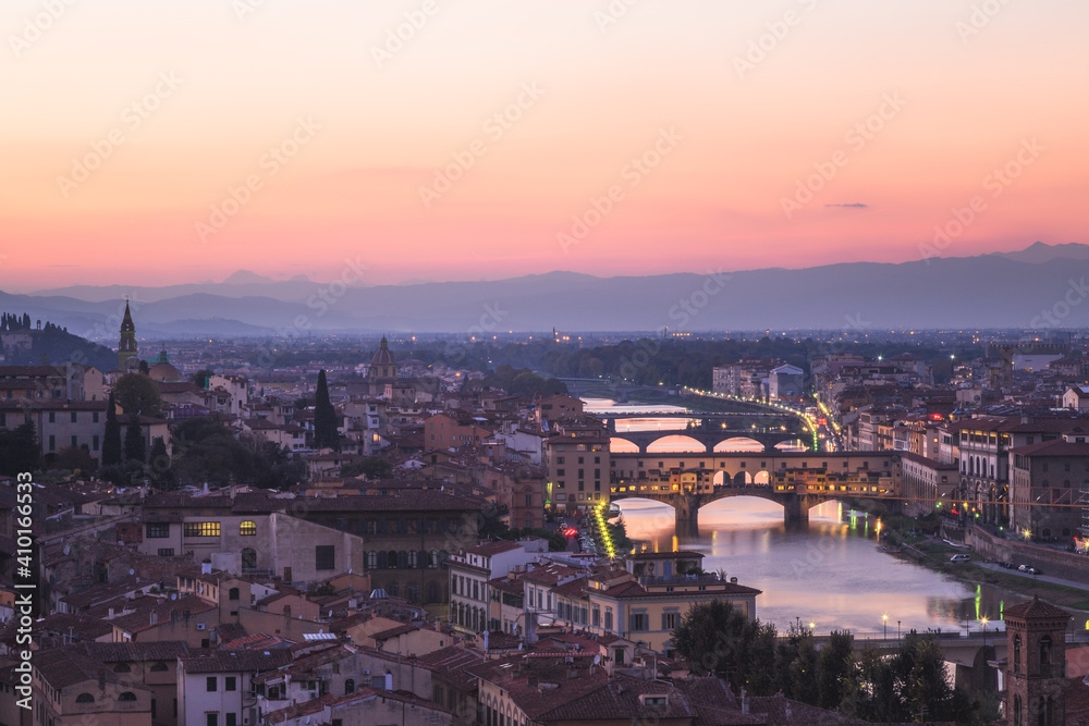 A sunset view of old town Florence cityscape skyline, River Arno and Ponte Vecchio from Piazzale Michelangelo.