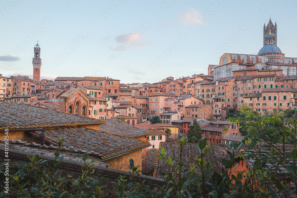 Scenic evening village view of Duomo di Siena and townscape of Siena, Italy in the heart of Tuscany.