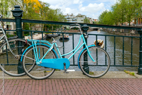 Amsterdam, canals and bikes. City travel concept.