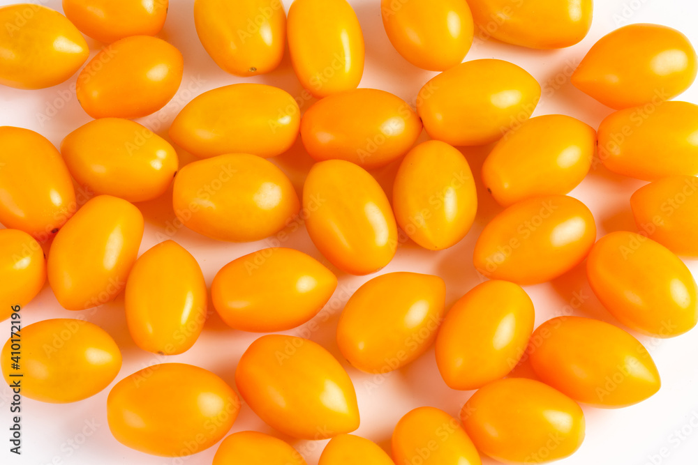 multiple yellow cherry tomatoes on a white background with shadow multiple yellow cherry tomatoes on a white background with shadow