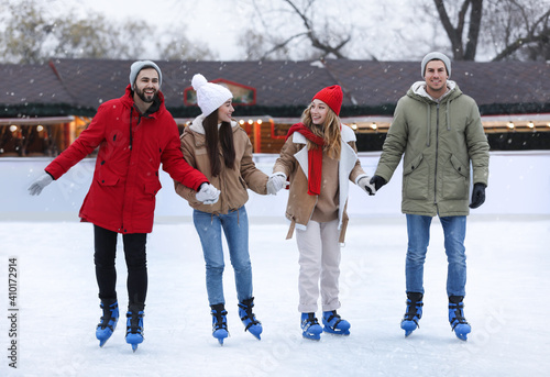 Group of friends at outdoor ice rink