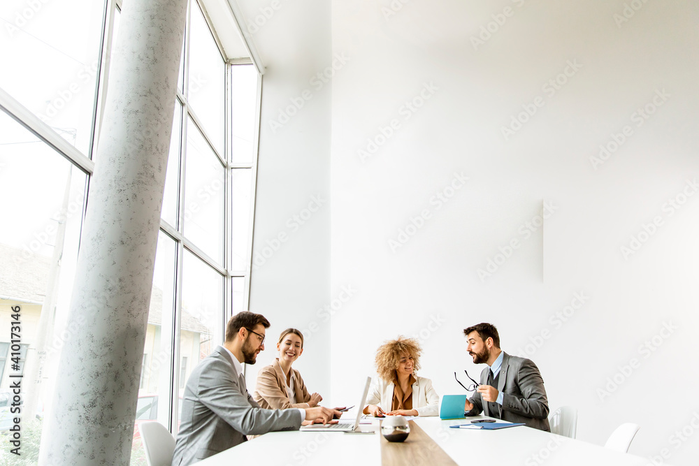Multiethnic young business people working together in the office Multiethnic young business people working together in the office
