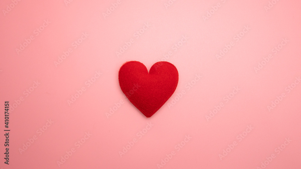 Red heart isolated on pink background, Valentine concept Top view Copy space.