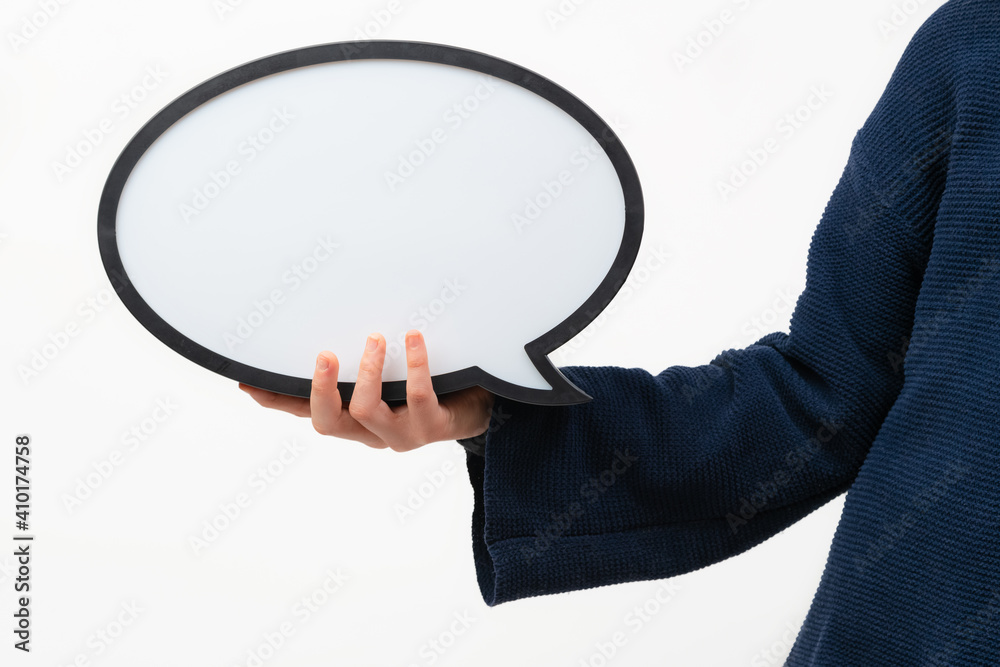 Close up of person holding blank speech bubble on white background. Communication and dialogue. Close up of person holding blank speech bubble on white background. Communication and dialogue.