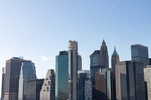 Office Skyscrapers in the Lower Manhattan Skyline of New York City with a Clear Blue Sky