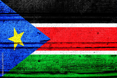 National flag of South Sudan, abbreviated with ss; a realistic 3d image of the national symbol from an independent country painted on a wooden wall