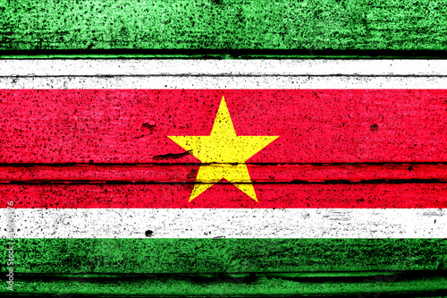 National flag of Suriname, abbreviated with sr; a realistic 3d image of the national symbol from an independent country painted on a wooden wall