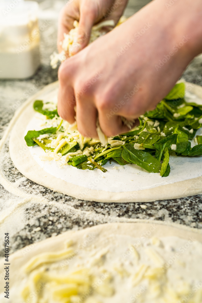 Pizaiolo Preparing Pizza in Restaurant with Fresh Ingredients. Chef at Work Pizaiolo Preparing Pizza in Restaurant with Fresh Ingredients. Chef at Work