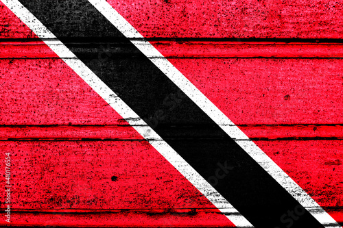 National flag of Trinidad and Tobago, abbreviated with tt  a realistic 3d image of the national symbol from an independent country painted on a wooden wall © pangamedia