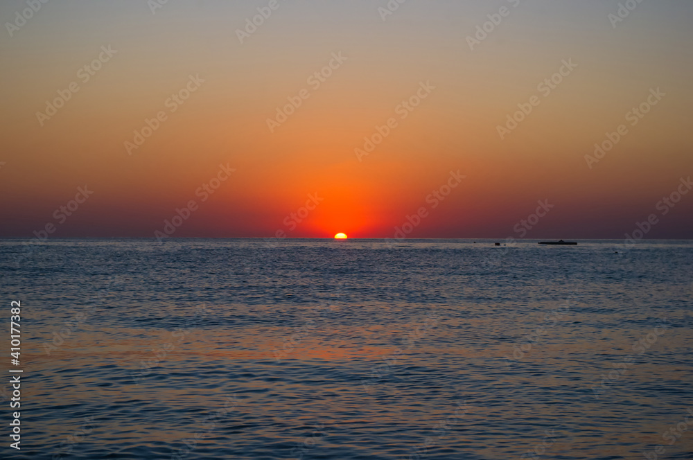 Amazing sea sunset, the sun, waves, clouds