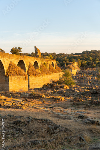 Destroyed abandoned Ajuda bridge crossing the Guadiana river between Spain and Portugal photo