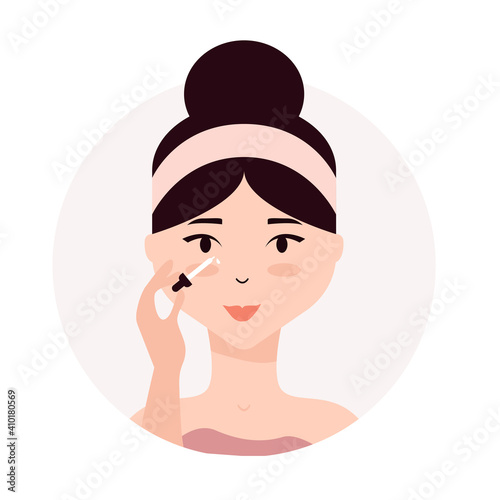 Woman taking care of her face. Daily skincare routine. Young woman applying moisturizing serum to her face. Cosmetic oil, skin hydration. 