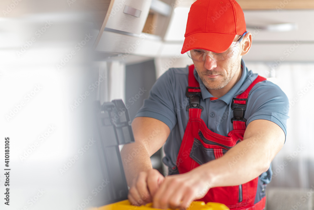 RV Industry Technician Inside Modern Travel Trailer RV Industry Technician Inside Modern Travel Trailer