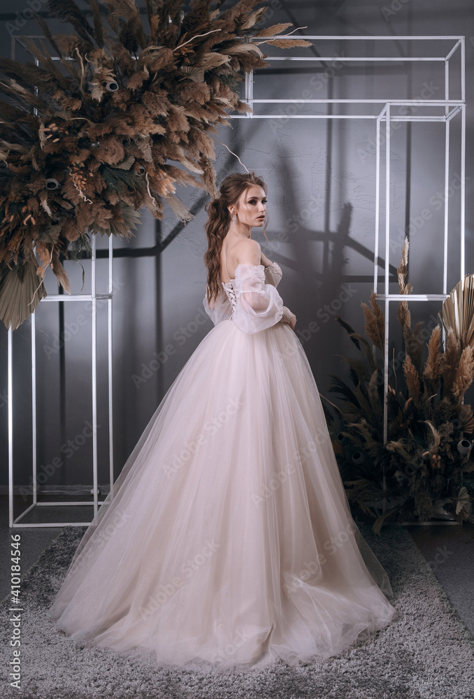 Fototapeta premium young girl in a luxurious wedding dress