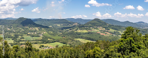 Panorama with mountains  forest and farms