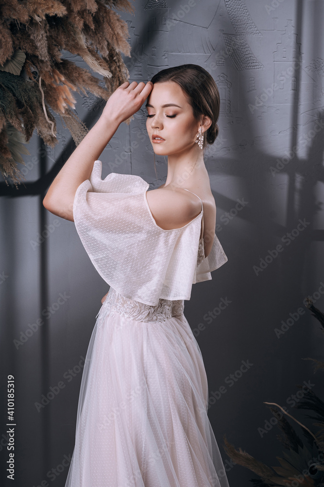 young girl in a luxurious wedding dress