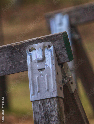 A face appears on a sawhorse clamp.