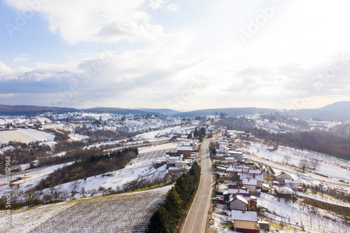 Aerial view of road crossing countryside village during winter, Croatia.