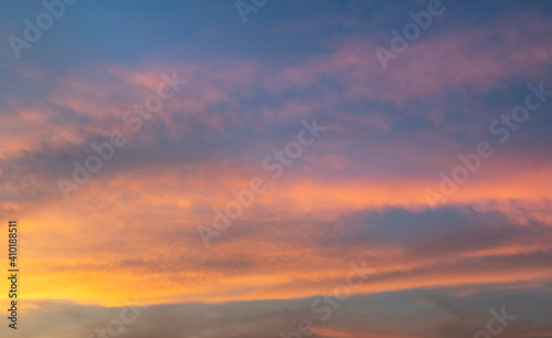 Beautiful colorful bright sunset sky with orange clouds. Nature sky background. Dramatic sunset.
