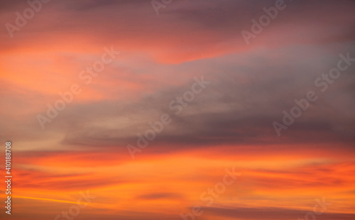 Fototapeta Naklejka Na Ścianę i Meble -  Beautiful colorful bright sunset sky with orange clouds. Nature sky background. Dramatic sunset.