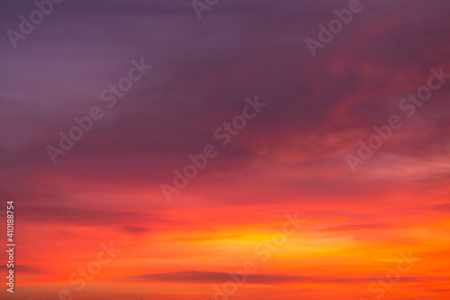 Beautiful colorful bright sunset sky with orange clouds. Nature sky background. Dramatic sunset. © Inga Av