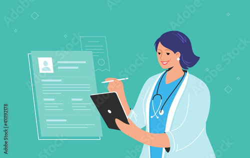 Electronic patient profile or online medical consulting on digital tablet. Smiling female doctor wearing white uniform holding tablet pc and checking patient e-profile for the distance consultation