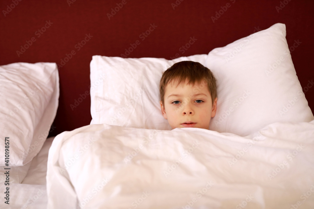 Boy lying in bed