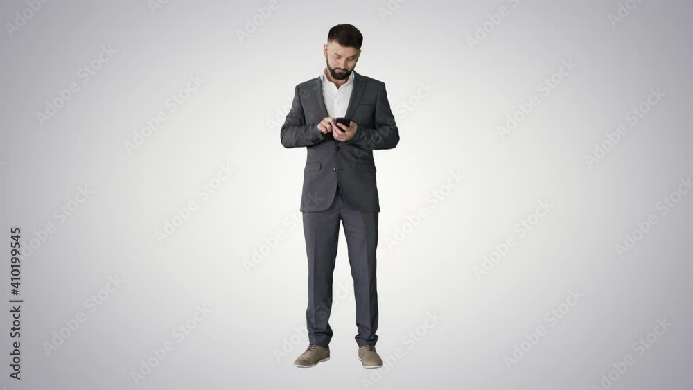 Turk business man texting on his phone on gradient background. Turk business man texting on his phone on gradient background.