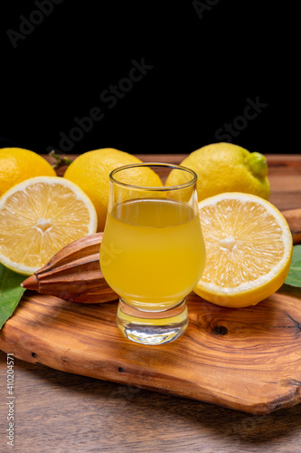 Ice cold sweet limoncello liqueur made from new harvest of fresh ripe yellow Italian lemons, Amalfi coast, Italy photo