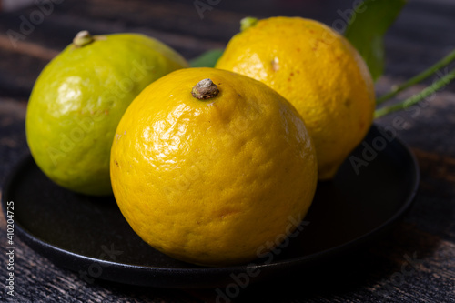 Fresh ripe bergamot orange fruits  fragrant citrus used in earl grey tea  medicine and spa treatments