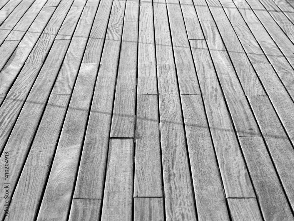 Black and white wooden slats on exterior floor Black and white wooden slats on exterior floor