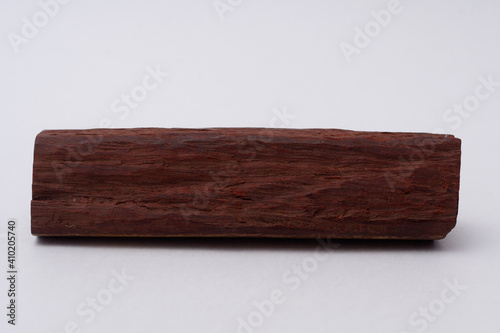 One sandalwood log on white background
