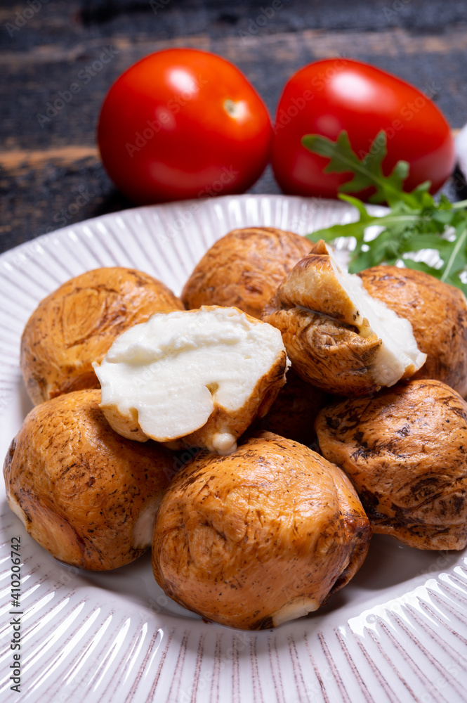 Tasty Italian food, small balls of smoked mozzarella soft cheese Tasty Italian food, small balls of smoked mozzarella soft cheese