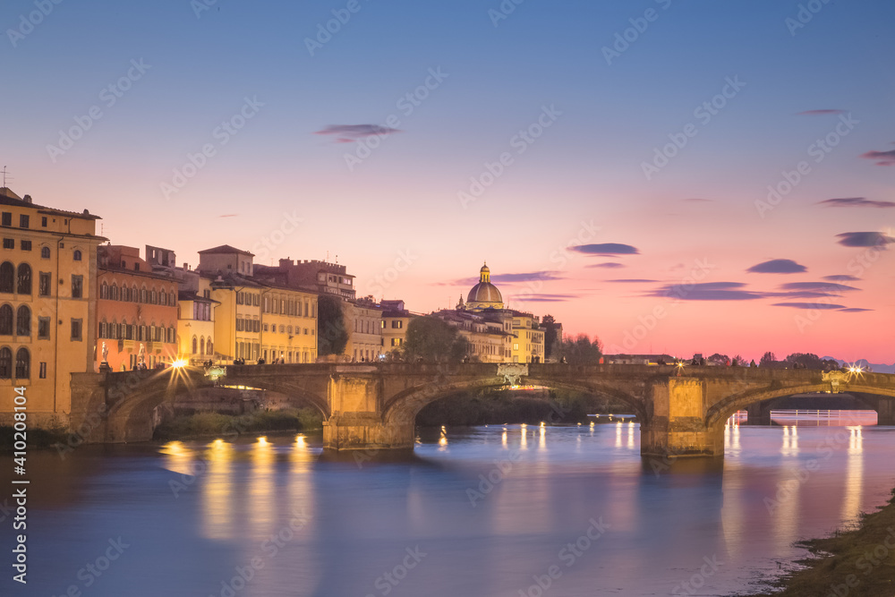 A sunset view of Florence, Tuscany, Italy and the River Arno on clear summer evening.