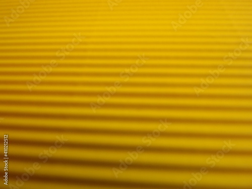 yellow background with longitudinal stripes as an abstraction. High quality photo