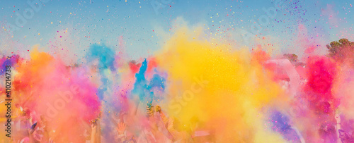 Fotografie, Obraz Group of people playing with colorful powder at a festival in South Africa