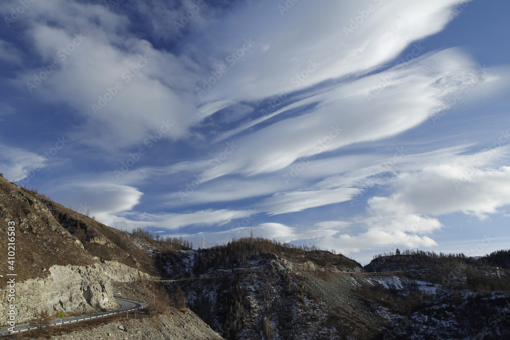 Incredibly beautiful clouds in the sky in the Altai mountains. Travel concept Incredibly beautiful clouds in the sky in the Altai mountains. Travel concept