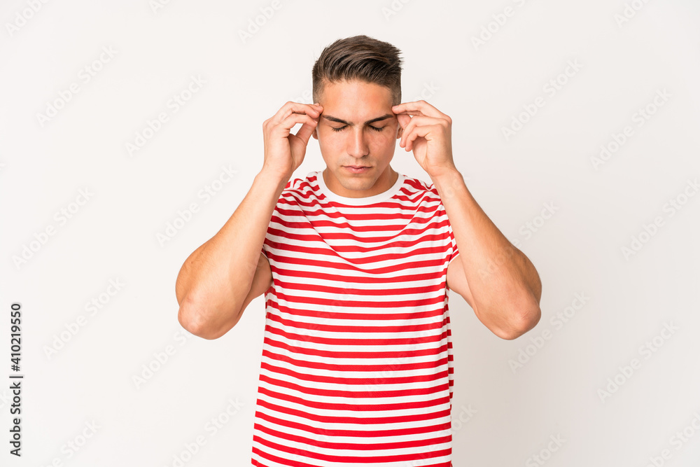 Young caucasian handsome man isolated touching temples and having headache. Young caucasian handsome man isolated touching temples and having headache.